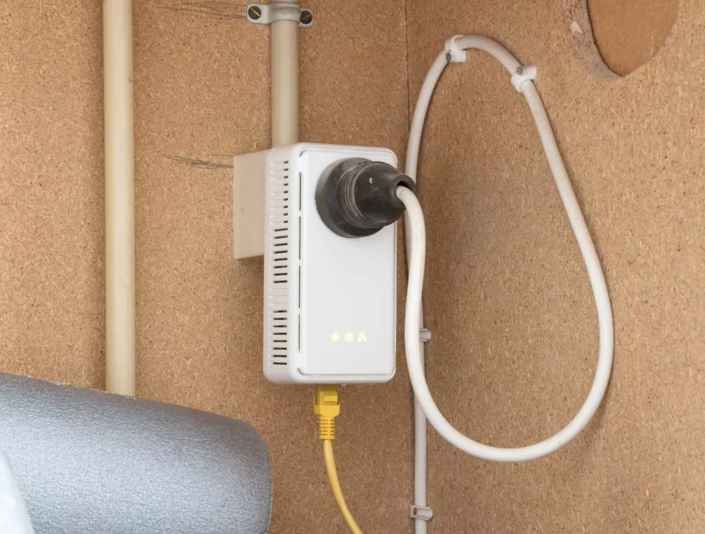Powerline network adaper plugged into a wall socket.