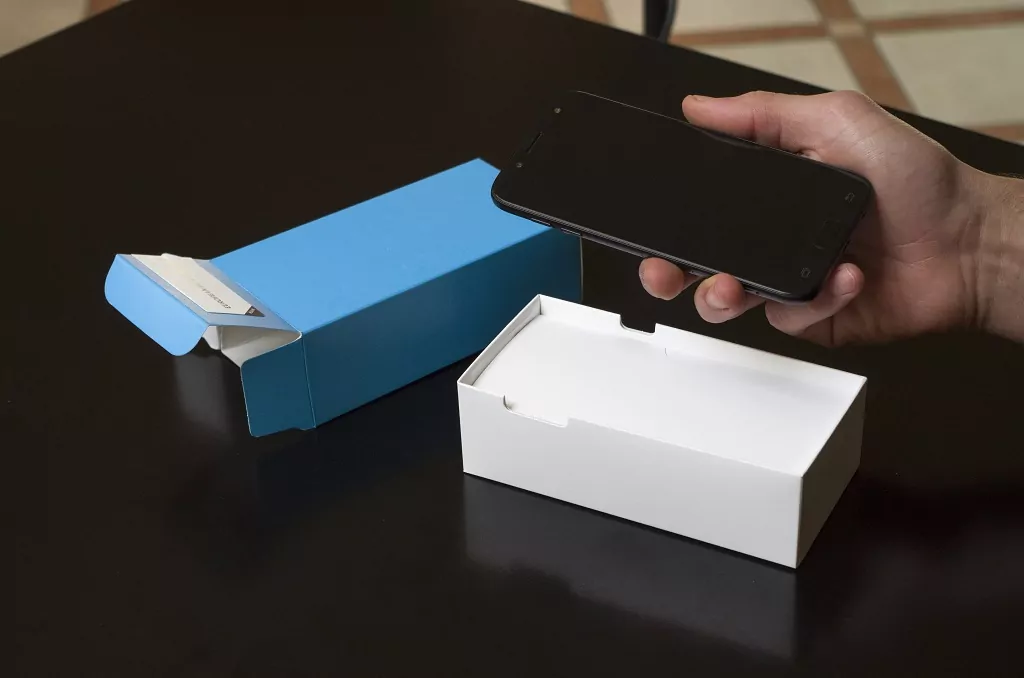 Unboxing a new smartphone.