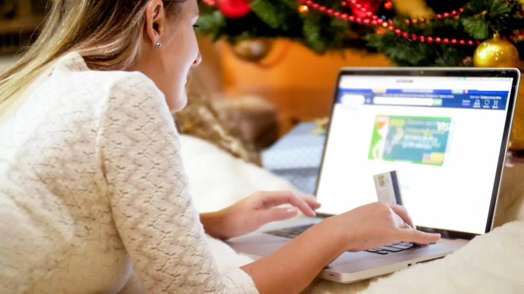 Woman ordering Christmas gifts online.